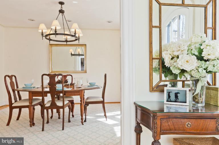 3219 Klingle Road Northwest Washington, DC 20008 - Photo 28 of 30 a view of a dining room with furniture and chandelier