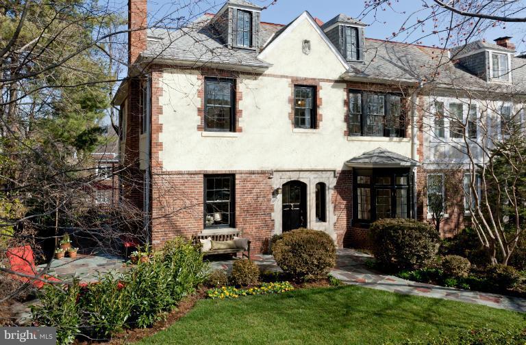 3219 Klingle Road Northwest Washington, DC 20008 - Photo 30 of 30 a front view of a house with a garden and plants