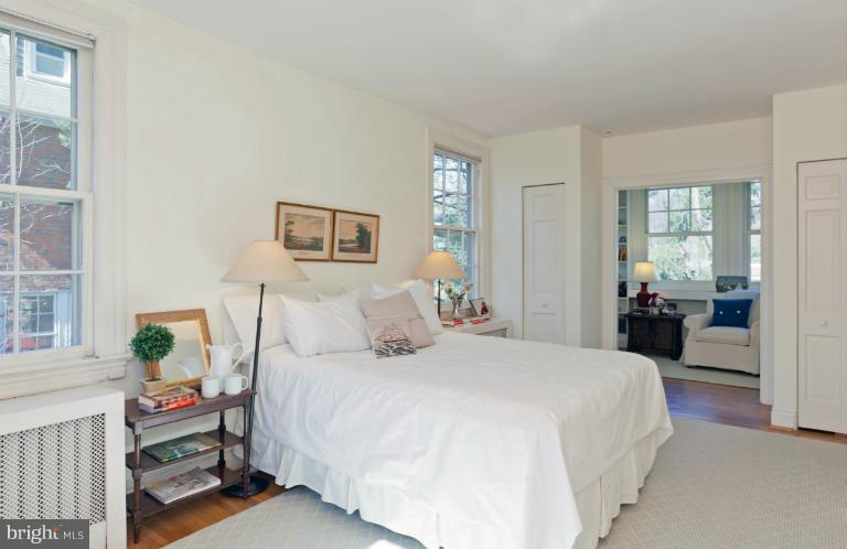 3219 Klingle Road Northwest Washington, DC 20008 - Photo 5 of 30 a bedroom with a bed and a couch