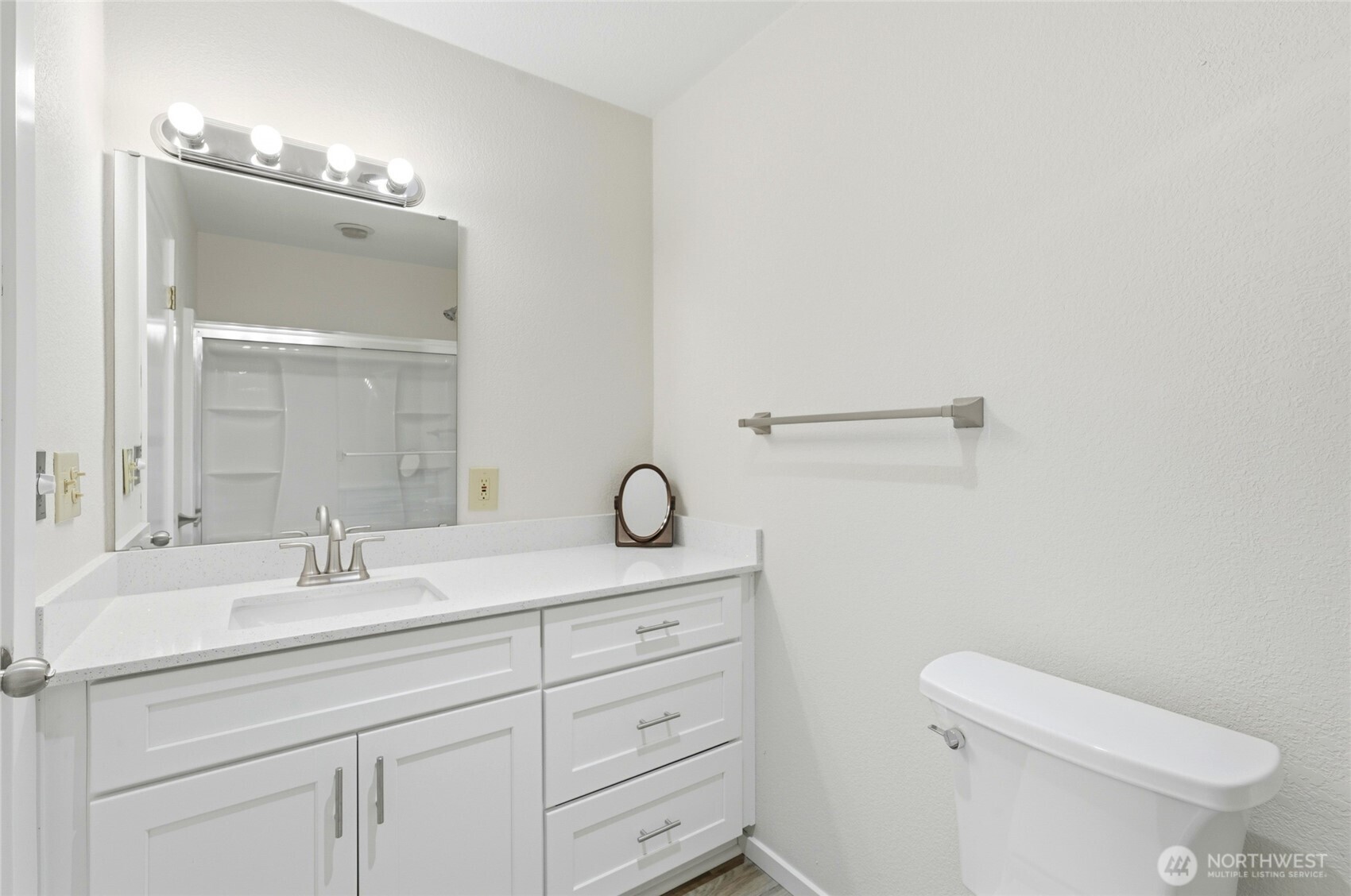 4404 Terrace Drive, Unit 8 Everett, WA 98203 - Photo 18 of 23 a bathroom with a granite countertop sink vanity mirror and toilet