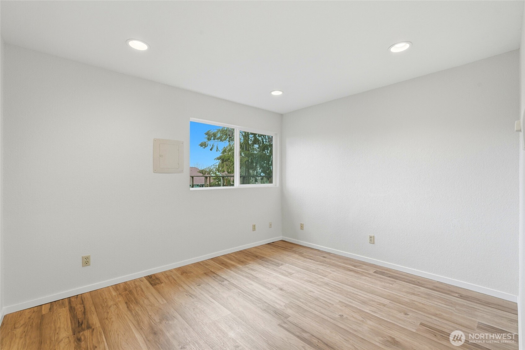 4404 Terrace Drive, Unit 8 Everett, WA 98203 - Photo 19 of 23 an empty room with wooden floor and window