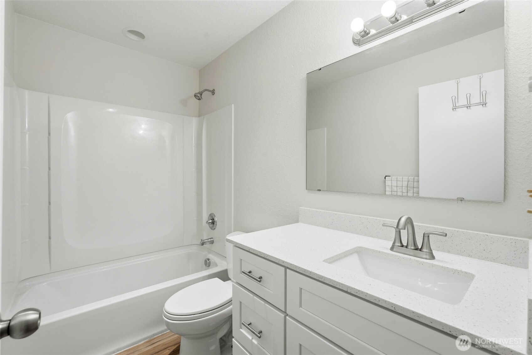 4404 Terrace Drive, Unit 8 Everett, WA 98203 - Photo 20 of 23 a bathroom with a sink a toilet and a large mirror