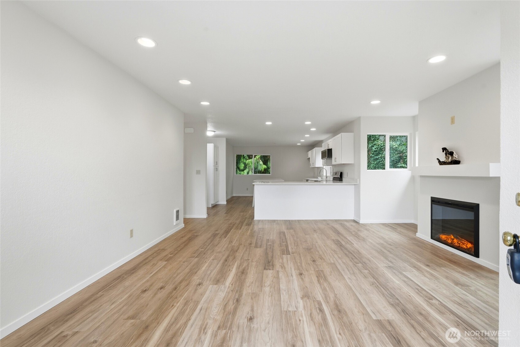 4404 Terrace Drive, Unit 8 Everett, WA 98203 - Photo 2 of 23 a view of a big room with wooden floor and fireplace