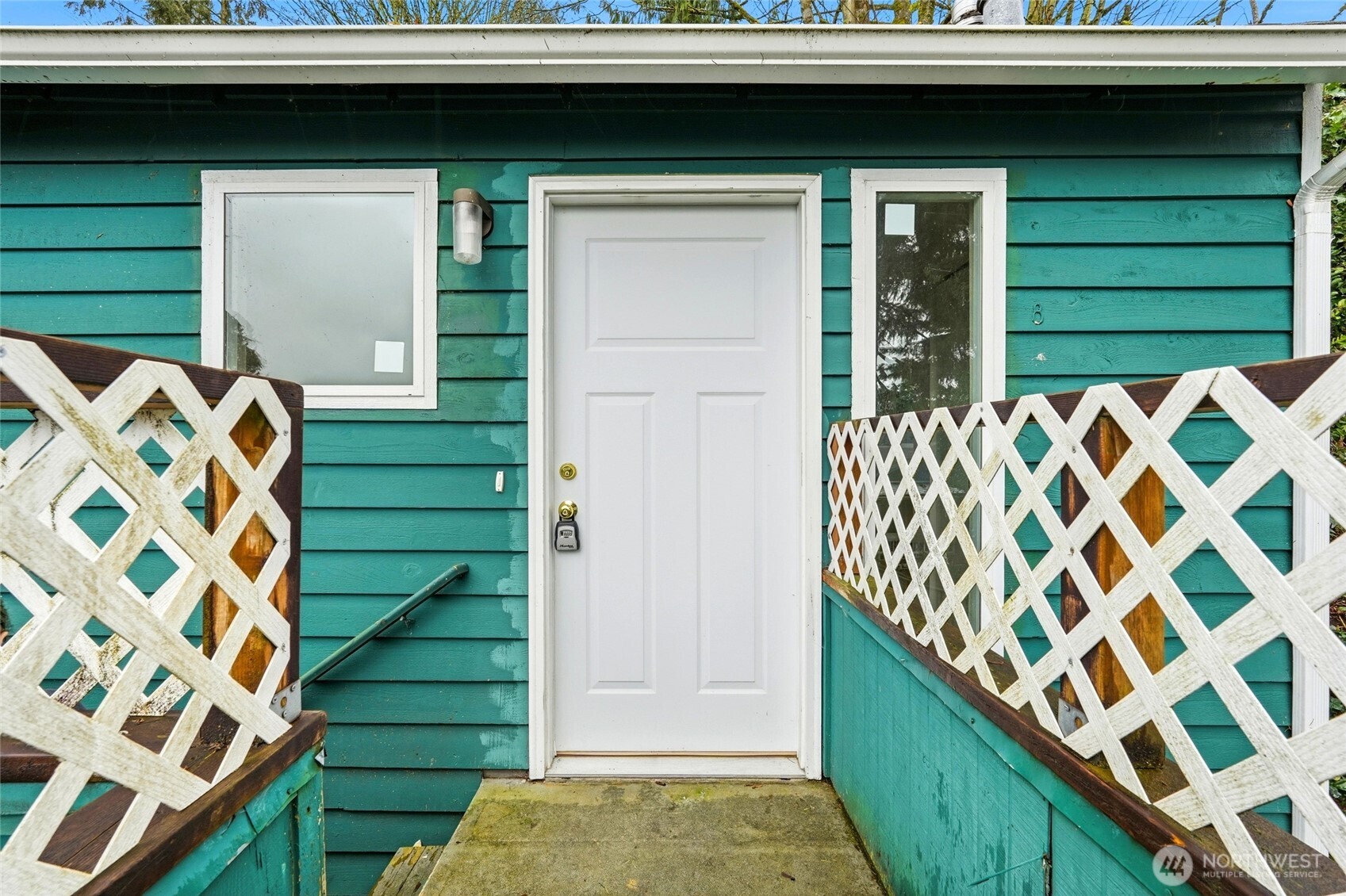 4404 Terrace Drive, Unit 8 Everett, WA 98203 - Photo 21 of 23 a front view of a house with a garden