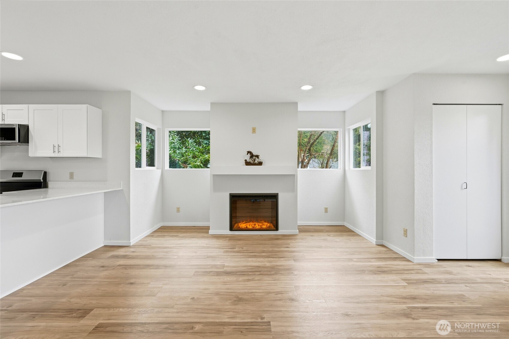 4404 Terrace Drive, Unit 8 Everett, WA 98203 - Photo 4 of 23 a view of a livingroom with a fireplace cabinet and a window