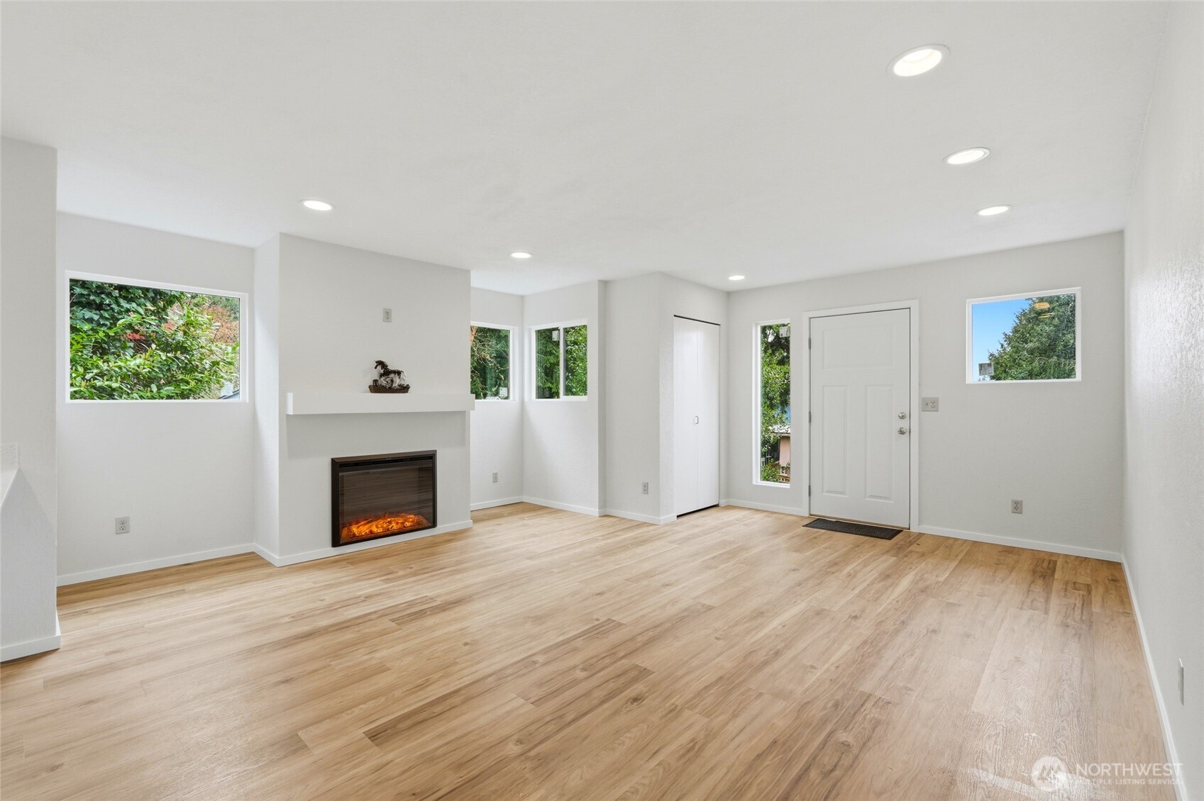 4404 Terrace Drive, Unit 8 Everett, WA 98203 - Photo 5 of 23 a view of empty room with wooden floor and fireplace