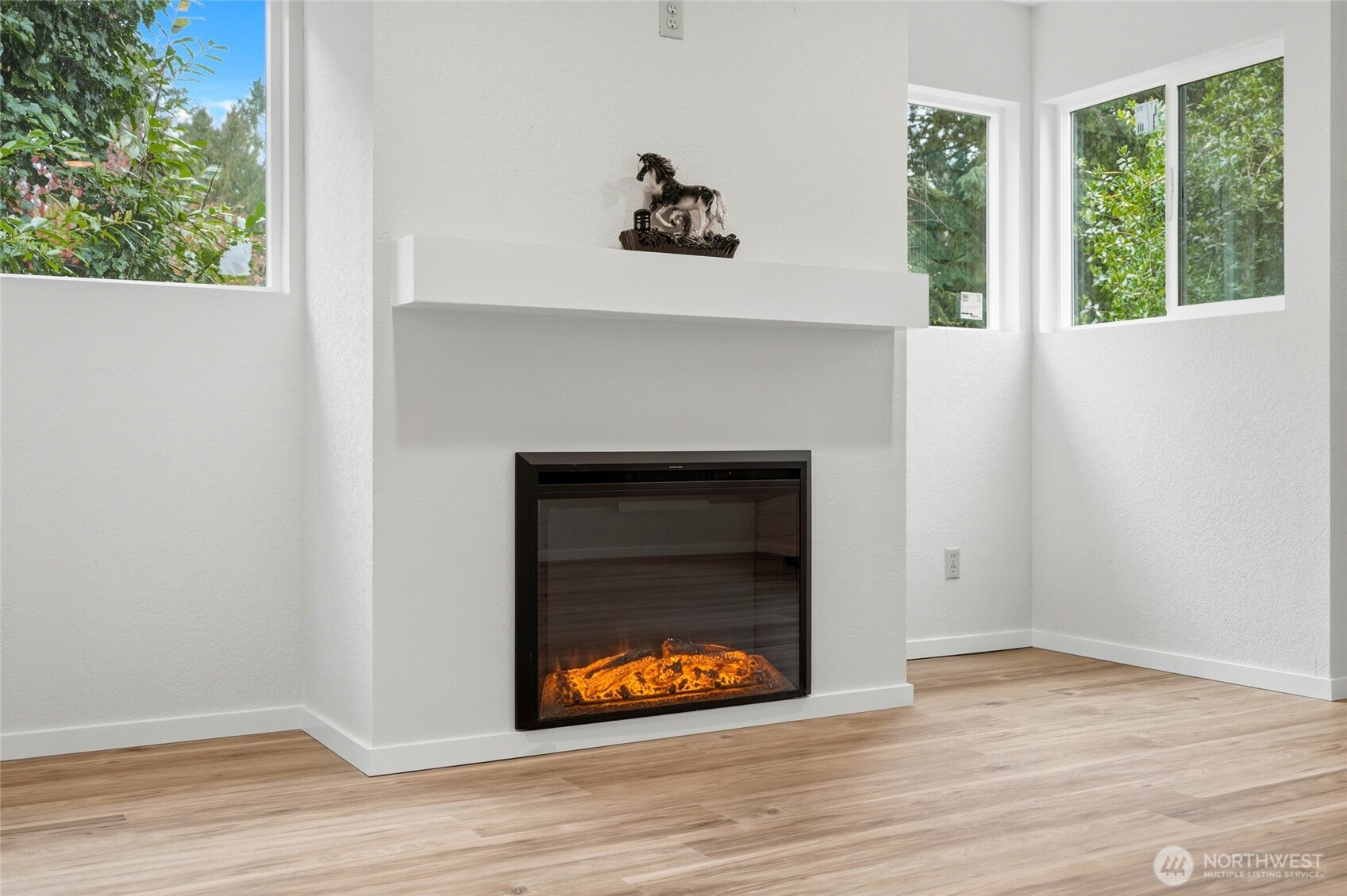 4404 Terrace Drive, Unit 8 Everett, WA 98203 - Photo 6 of 23 a view of an empty room with wooden floor and a window