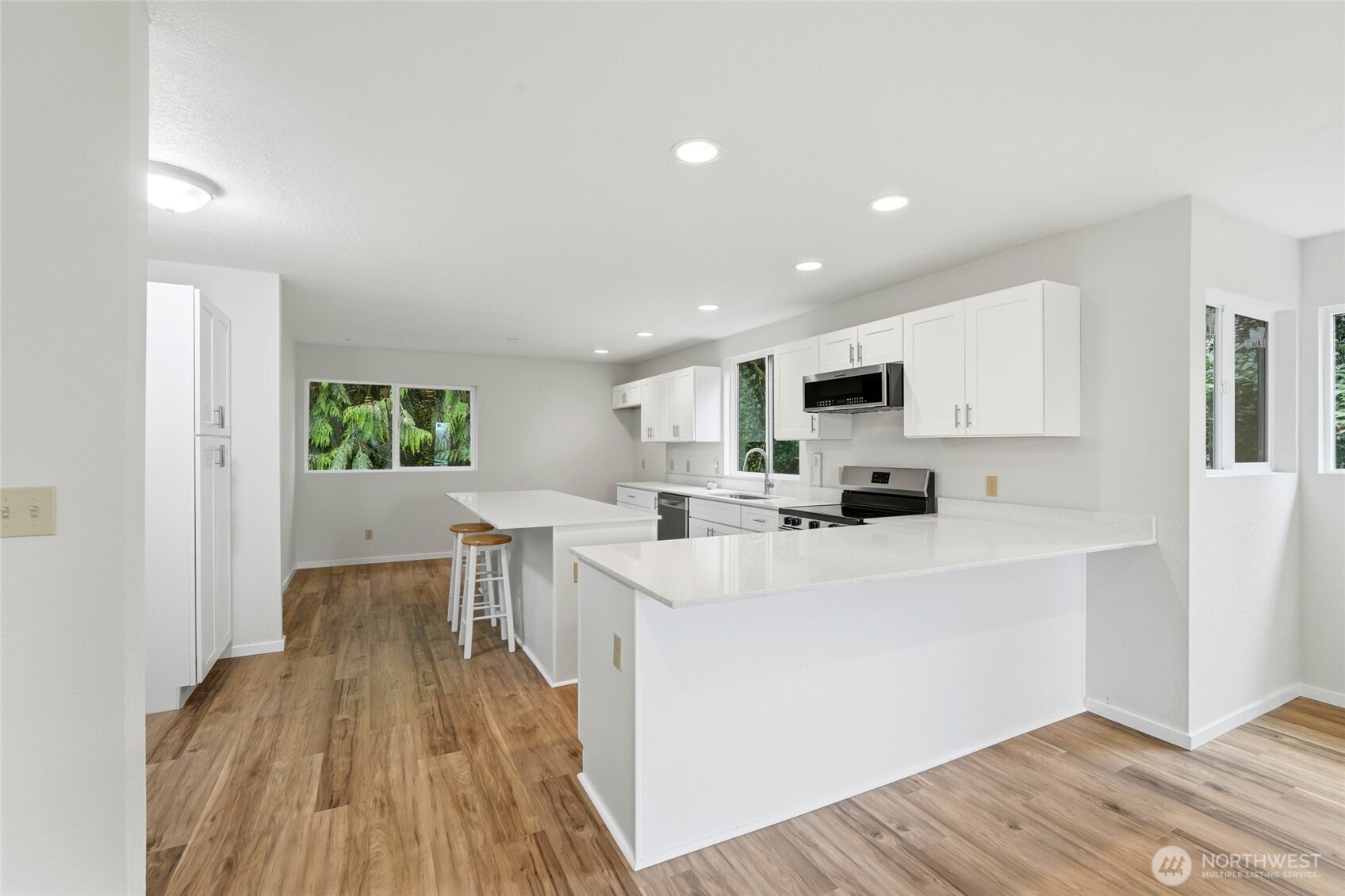 4404 Terrace Drive, Unit 8 Everett, WA 98203 - Photo 9 of 23 a view of kitchen with cabinets and wooden floor