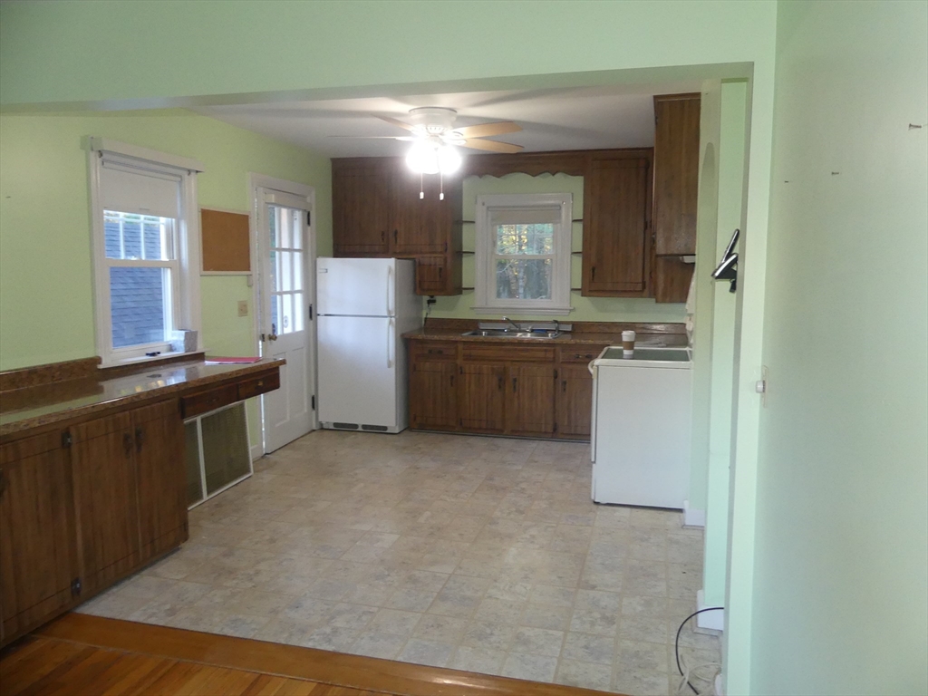 151 Fowler Road Northbridge, MA 01534 - Photo 8 of 29 a kitchen with stainless steel appliances granite countertop a stove a sink and a refrigerator