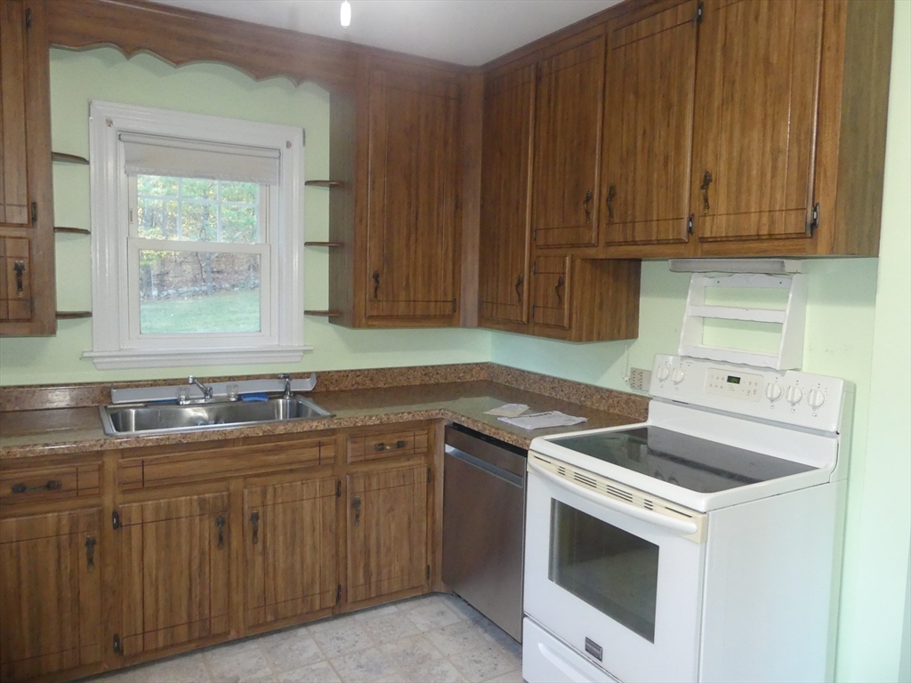 151 Fowler Road Northbridge, MA 01534 - Photo 9 of 29 a kitchen with sink cabinets and window