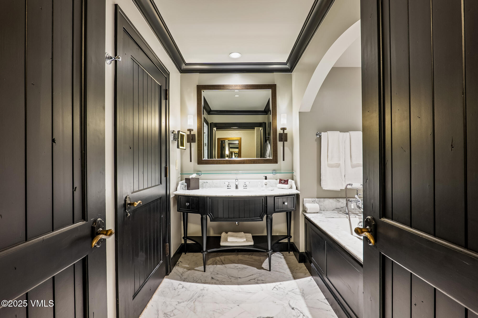 130 Daybreak Ridge Road, Unit HS319 Avon, CO 81620 - Photo 12 of 30 a bathroom with a sink a mirror and a shower