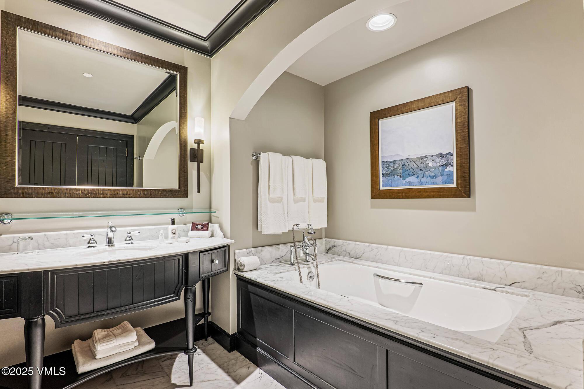 130 Daybreak Ridge Road, Unit HS319 Avon, CO 81620 - Photo 13 of 30 a bathroom with a sink and a mirror