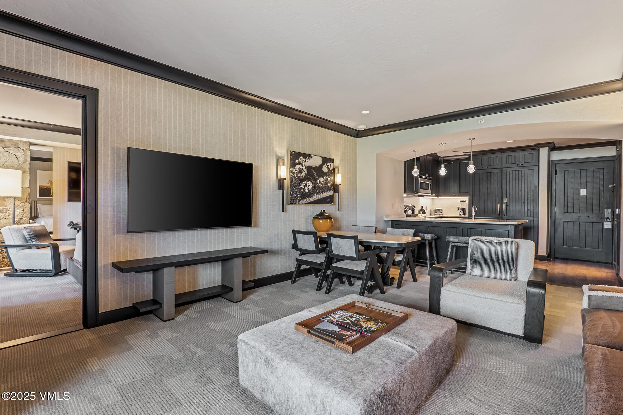 130 Daybreak Ridge Road, Unit HS319 Avon, CO 81620 - Photo 5 of 30 a living room with furniture and a flat screen tv