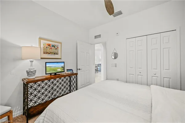 a bedroom with a bed and a cabinets