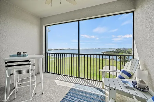 a view of a balcony with furniture