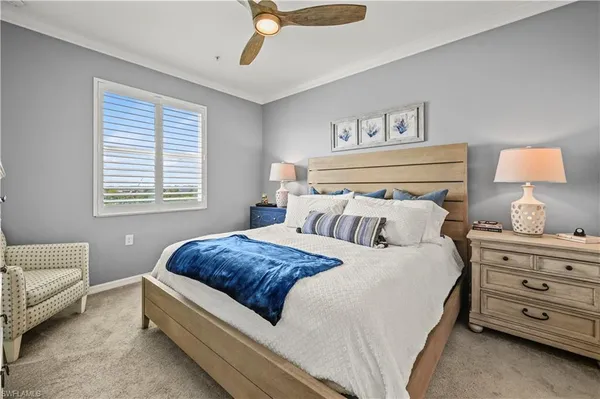 a bedroom with a bed and a lamp