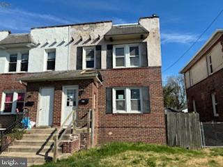 273 Broad Street Carneys Point, NJ 08069 - Photo 2 of 14 a front view of a house with a yard