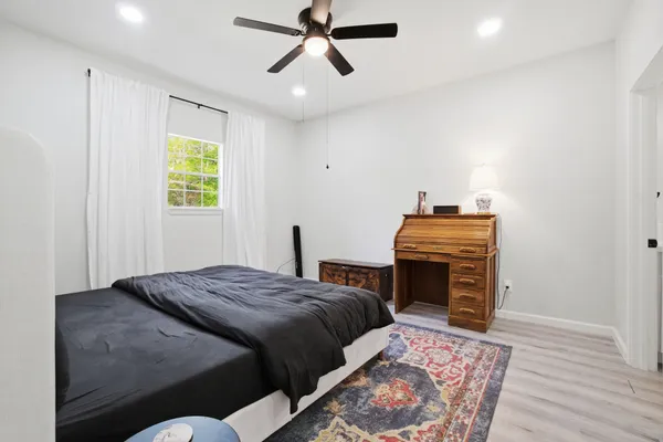 a bedroom with a bed and a dresser