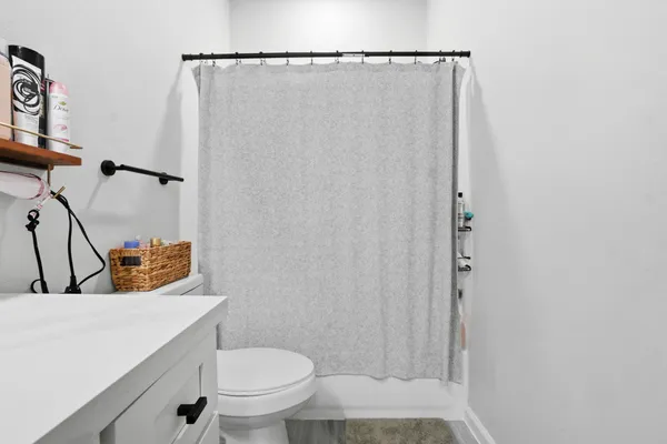 a bathroom with a toilet and a sink