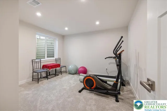 a bathroom with a granite countertop toilet