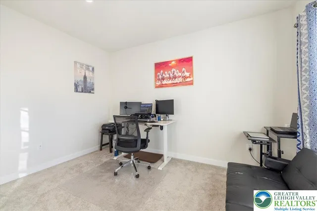 a view of a workspace with furniture