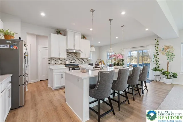 a kitchen with a stove and a refrigerator