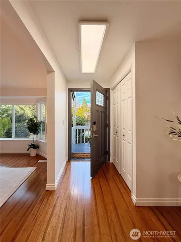 a view of interior space with wooden floor and furniture