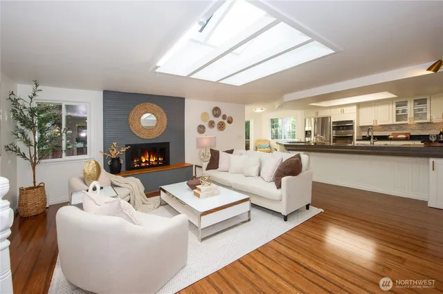 a living room with fireplace furniture and a fireplace