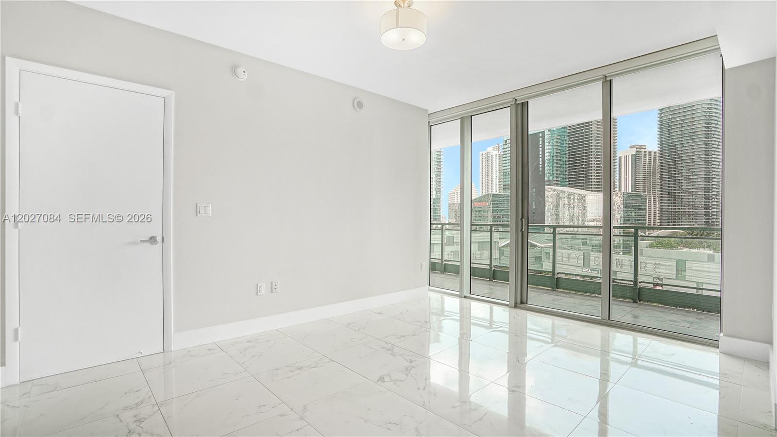 92 Southwest 3rd Street, Unit 1803 Miami, FL 33130 - Photo 7 of 29 a view of an empty room and window