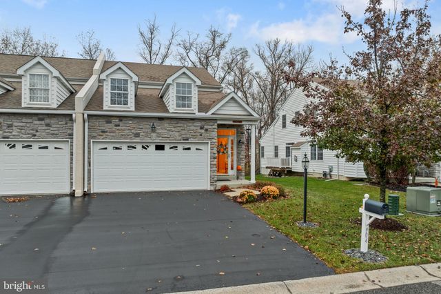 a view of a garden with a house