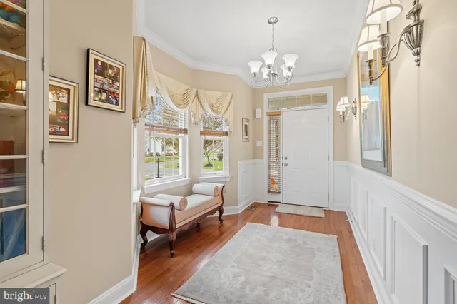 a living room with furniture a fireplace and a window