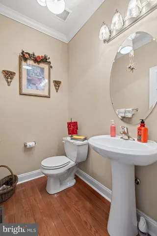 a kitchen with granite countertop stainless steel appliances a refrigerator cabinets and a sink