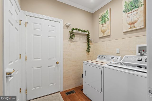 a bathroom with a sink a mirror and shower