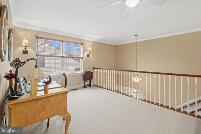 a bedroom with a bed a dresser and a window