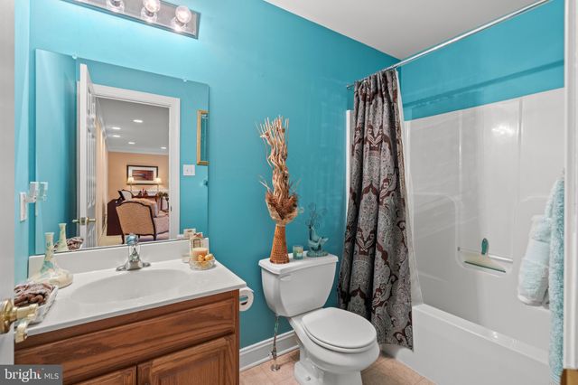 an aerial view of a house with a mountain