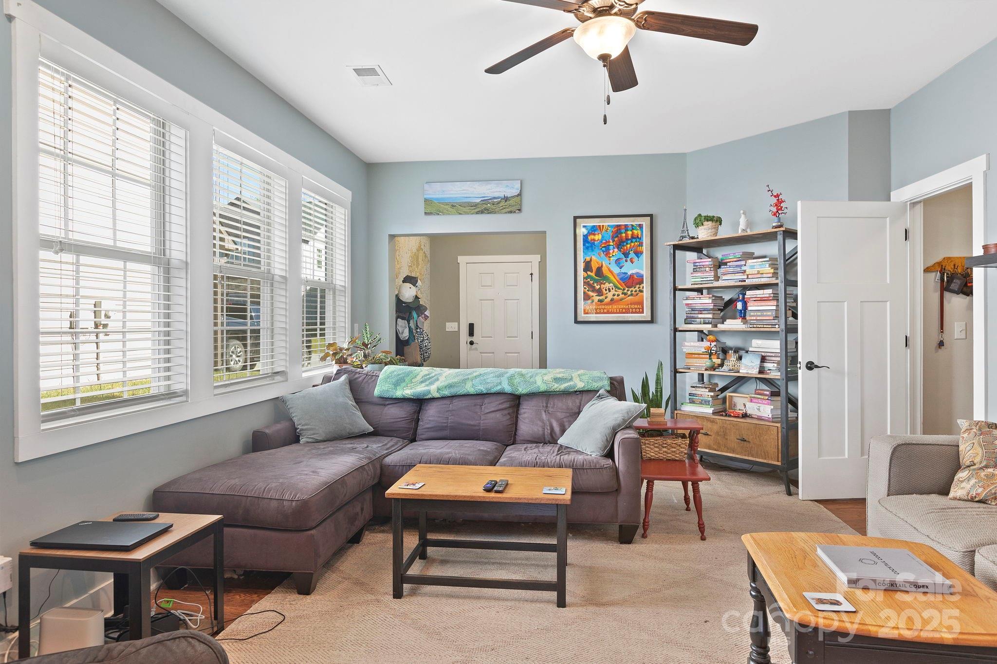 28 South River Road Fletcher, NC 28732 - Photo 12 of 47 a living room with furniture a ceiling fan and a window