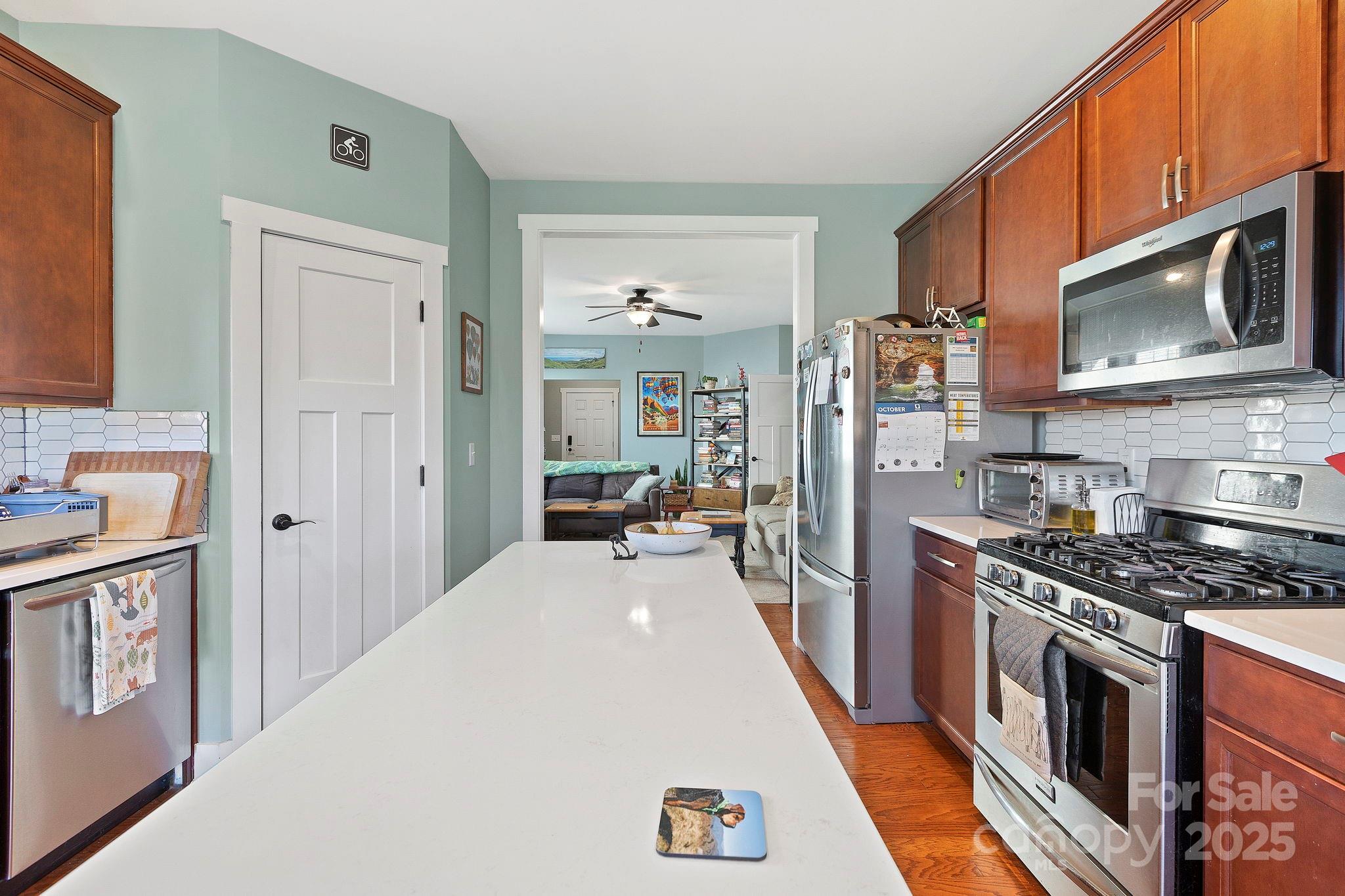28 South River Road Fletcher, NC 28732 - Photo 17 of 47 a kitchen with stainless steel appliances a stove microwave and a refrigerator
