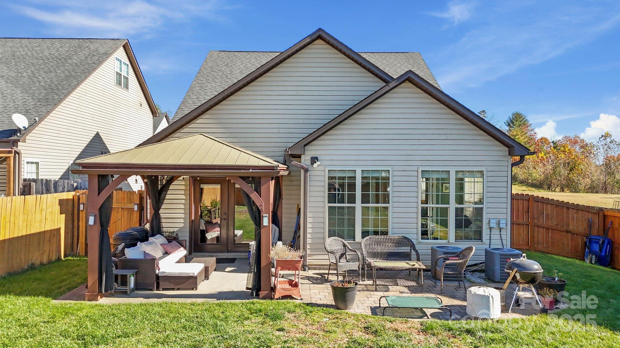28 South River Road Fletcher, NC 28732 - Photo 5 of 47 a building outdoor space with patio furniture and potted plants