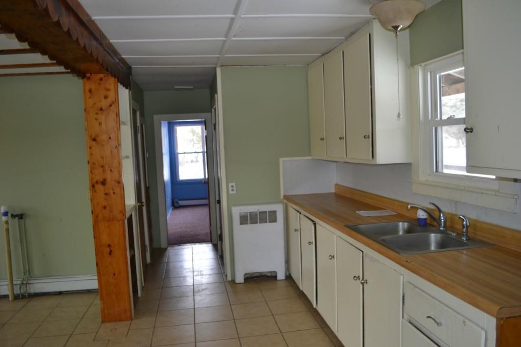 377 East Dover Road Dover-Foxcroft, ME 04426 - Photo 3 of 20 Galley Kitchen. Note laundry hook up...
