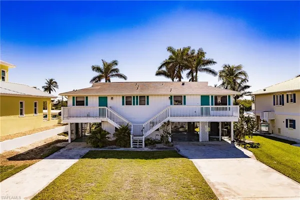 a front view of a house with swimming pool