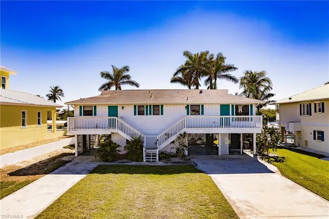 a front view of a house with swimming pool
