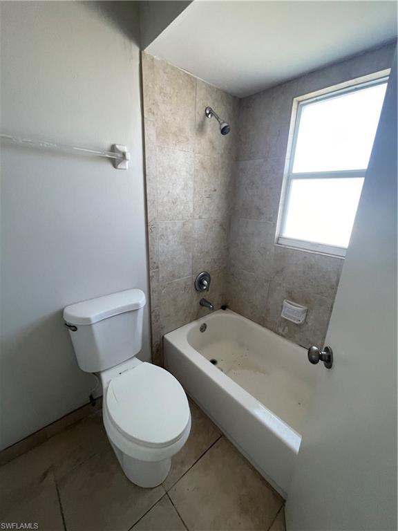 4861 Regal Drive Bonita Springs, FL 34134 - Photo 21 of 33 a white toilet sitting next to a bathroom sink