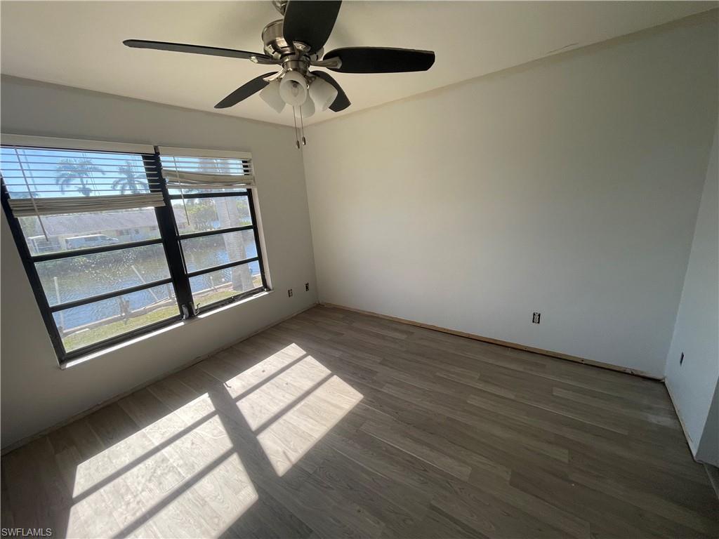 4861 Regal Drive Bonita Springs, FL 34134 - Photo 25 of 33 a view of a livingroom with a ceiling fan and window