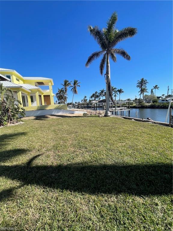 4861 Regal Drive Bonita Springs, FL 34134 - Photo 31 of 33 a view of a swimming pool with a lake view