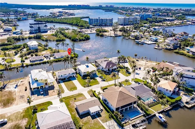 an aerial view of a house with a lake view