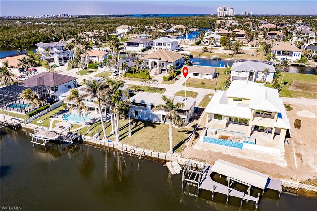 4861 Regal Drive Bonita Springs, FL 34134 - Photo 8 of 33 an aerial view of a swimming pool with outdoor seating