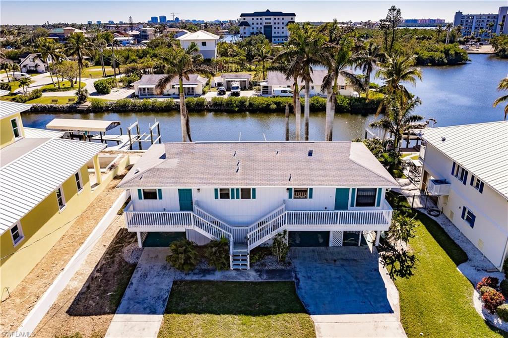 4861 Regal Drive Bonita Springs, FL 34134 - Photo 10 of 33 a aerial view of a house with wooden floor and lake view