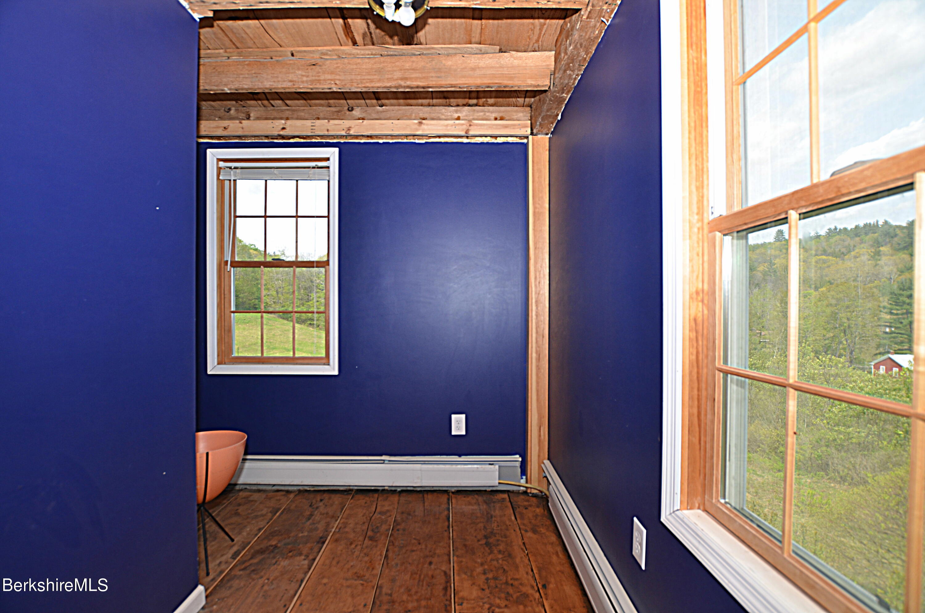 104 North Chester Road Chester, MA 01011 - Photo 29 of 54 a view of a hallway with wooden floor and a window