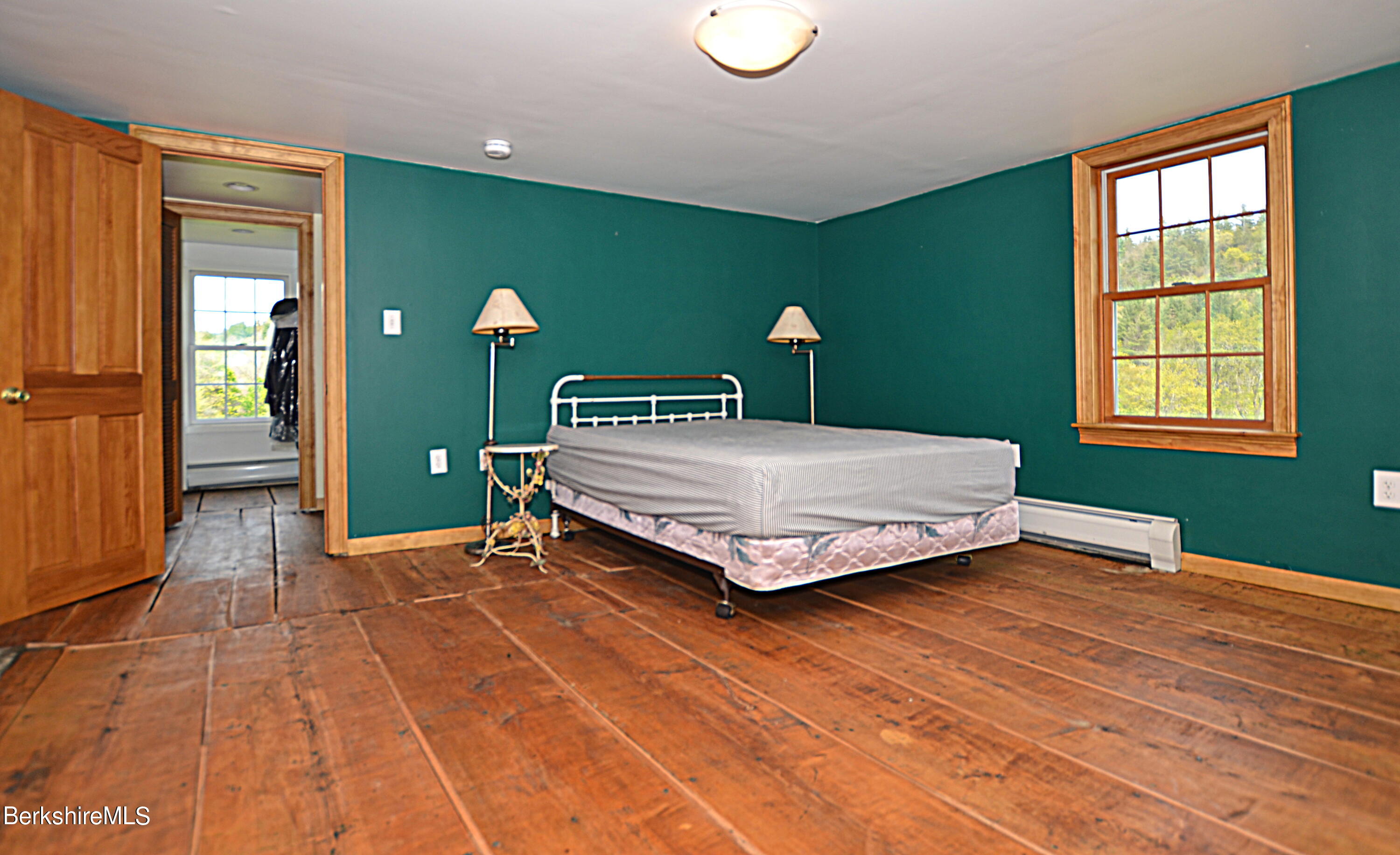 104 North Chester Road Chester, MA 01011 - Photo 37 of 54 a bedroom with a bed and large windows