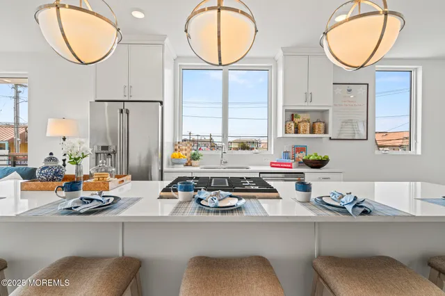 a bathroom with double sink and a mirror